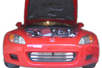 Ultimate Racing S2000 turbo kit in red car